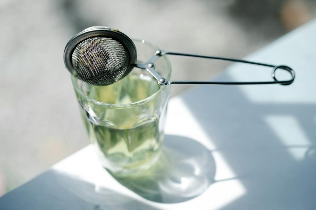 Best Tips For An Eco Friendly Kitchen. Close-up of Tea Infuser on Glass